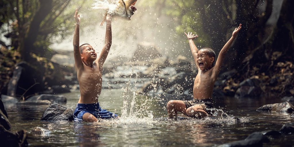 happy family playing together in a park