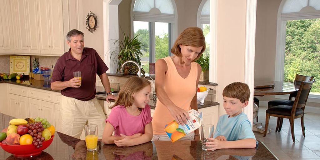 family enjoying healthy meal at home