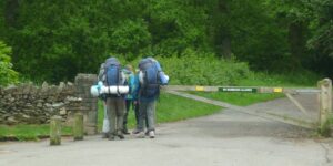 parents guiding child in a park