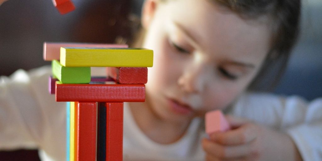 children playing learning toys classroom