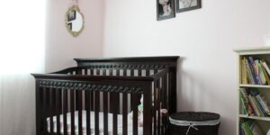 new parents with baby in nursery room