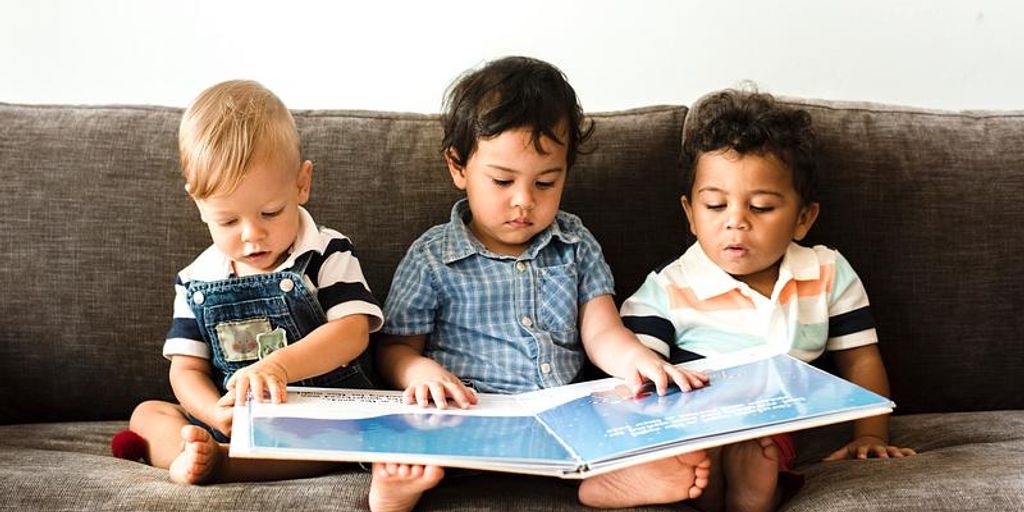 parent and child reading together at home