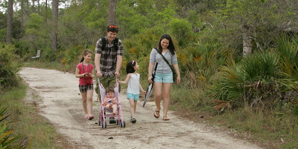 happy family playing in a park