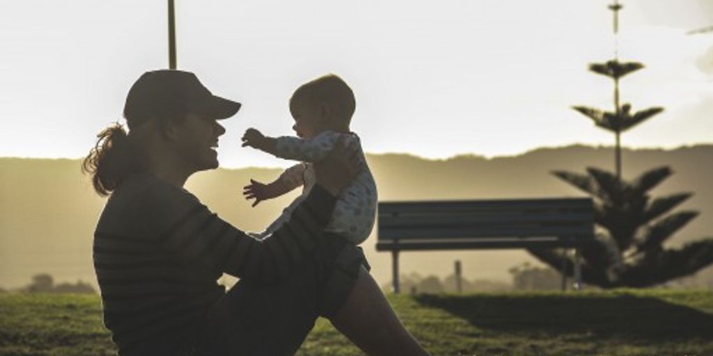 happy family playing together in a park