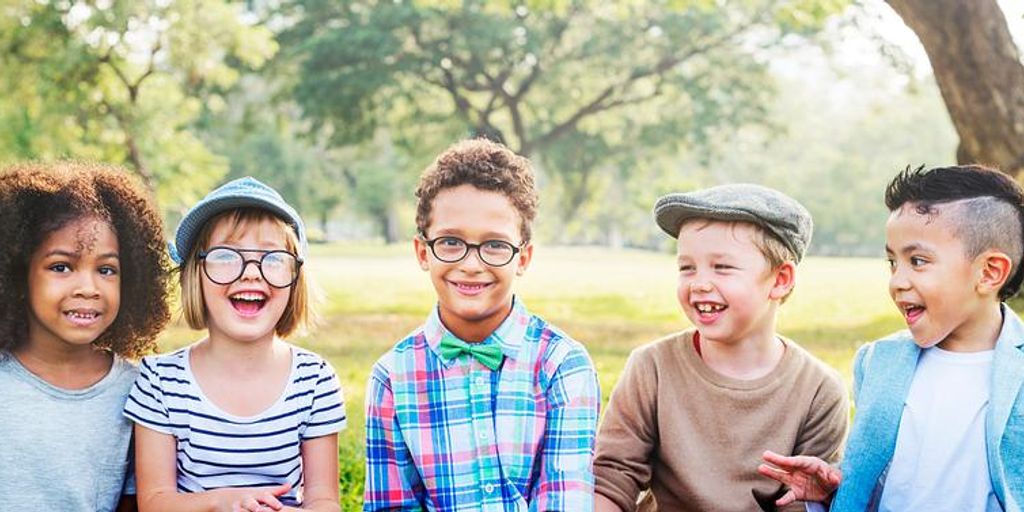 happy family playing together in a park