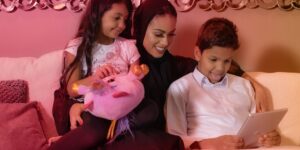 parents guiding child in a park