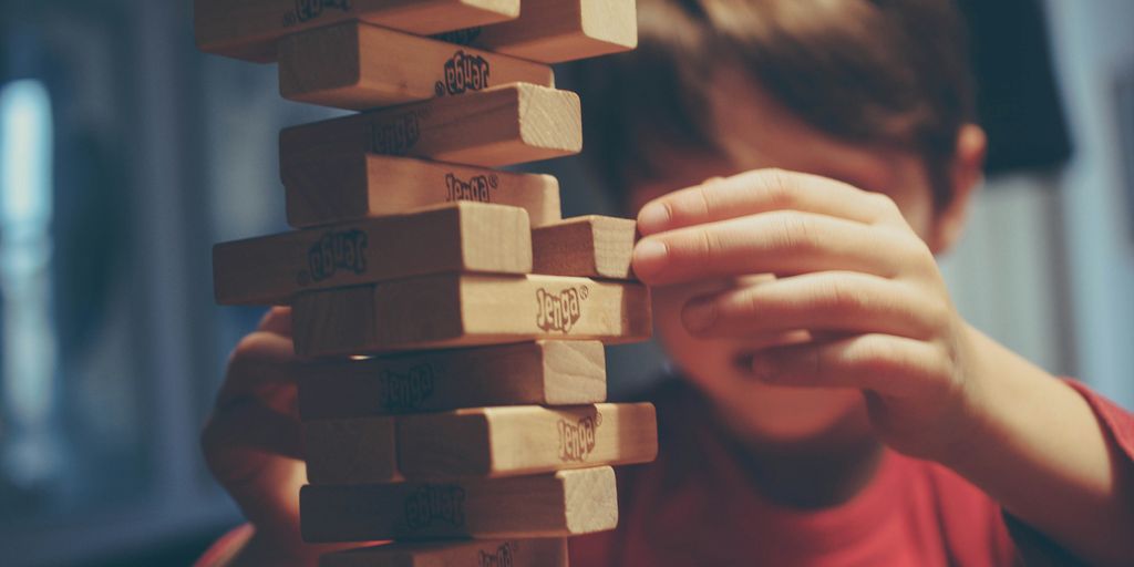 boy playing jenga